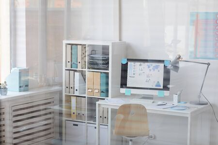 Image of workplace with computer with medical presentation on the screen at doctor's office