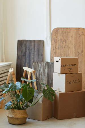 Image of packed things and heap of signed boxes prepared for relocation