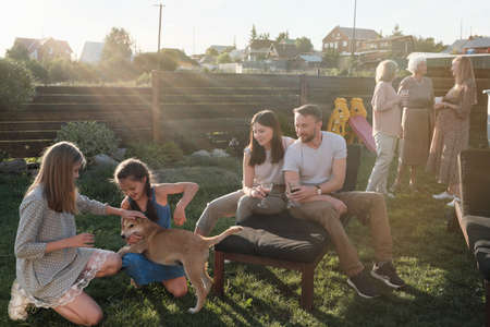 Big family resting together outdoors in the countrysideの写真素材