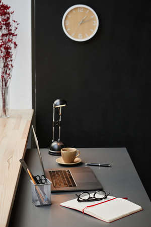 Image of modern workplace with laptop and notebook of business person at office