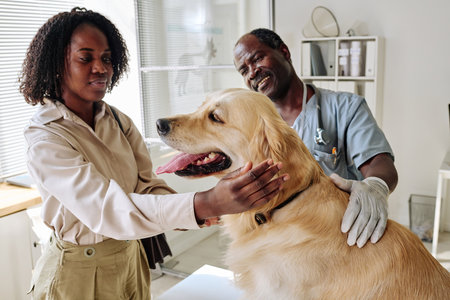 African woman with her dog visiting vet doctor at clinicの写真素材