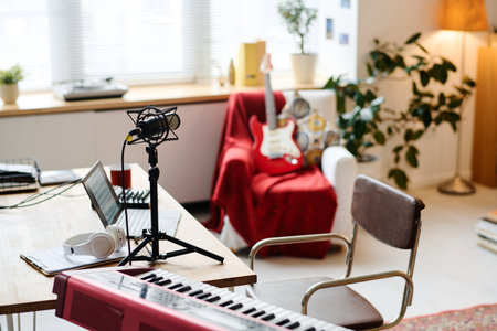 Modern recording studio with synthesizer and microphone on tableの写真素材