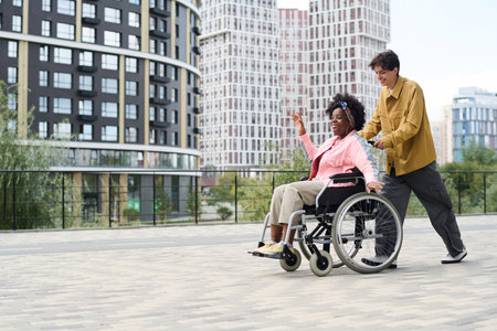 Happy woman with disability having fun with her friend in the city