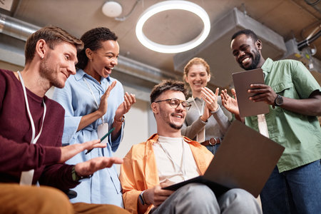 Group of business people making successful online project, they smiling and clapping handsの写真素材