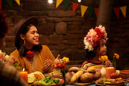 People celebrating the holiday at dining table together, they talking and laughing