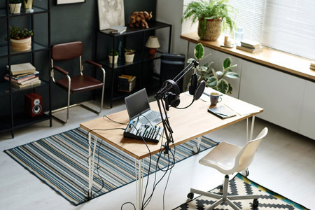 Above angle of workplace of radio presenter with various equipment necessary for sound recording and broadcastingの写真素材