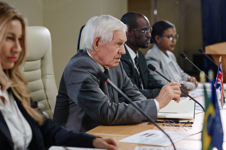 Business people speaking in microphone and discussion questions at business conference