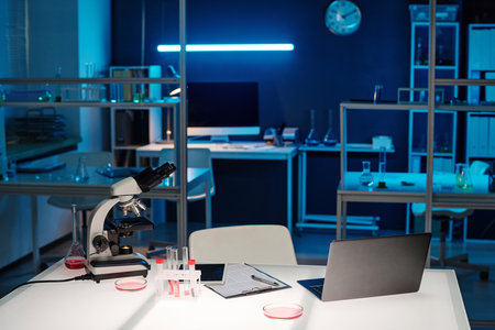 Workplace with glassware and professional technical equipment in scientific laboratoryの写真素材