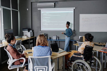 African american programmer giving presentation on board, multi-ethnic colleagues listening to her