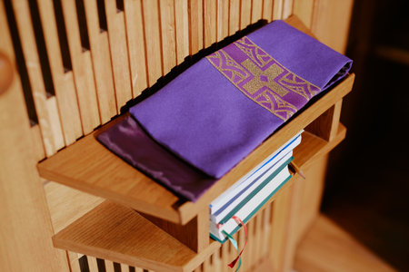 High angle view of embroidered gospel bookmarks and books on shelves in churchの写真素材