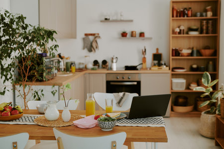 Modern spacious fully equipped kitchen with cozy dining zoneの写真素材