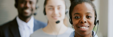 Website header demonstrating first class call center specialists looking at camera and smilingの写真素材