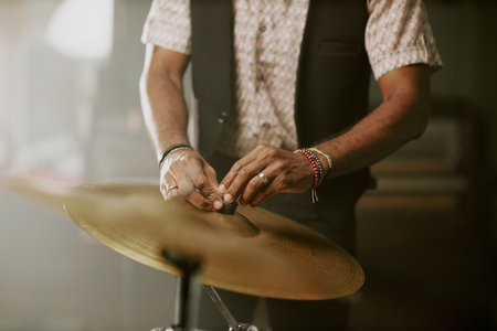 Medium section of unrecognizable musician setting hid drum kit for rehearsal or performanceの写真素材