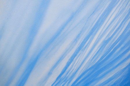 Abstract pattern featuring blue and white shades creating fluid lines on wall. Image depicts intricate textures and gentle color transitionsの写真素材