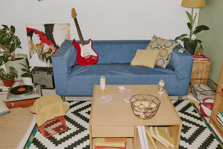 High angle shot of modern and comfort living room with interior objects and hobby itemsの写真素材