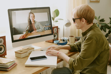 Unrecognizable man reading Braille book white spending free time at homeの写真素材