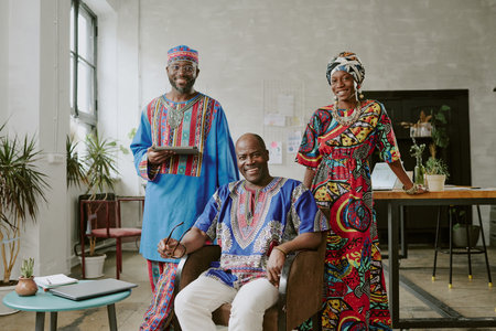 Portrait of African American businessmen posing for photo together in modern loft officeの写真素材