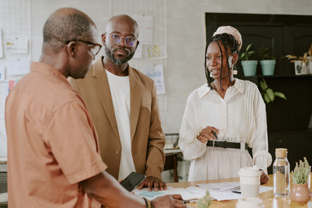 African American team discussing new plan in modern officeの写真素材