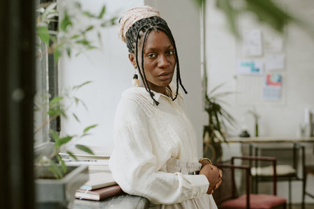 Confident African American businesswoman posing for portrait in officeの写真素材