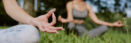 Website banner of manicure female hand during open air meditation in parkの写真素材