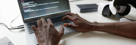 Website banner of unrecognizable man typing on laptops keyboardの写真素材