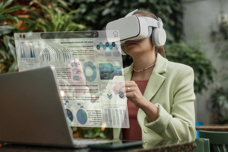 Young woman sitting in cafe with VR goggles and interacting with VR business app