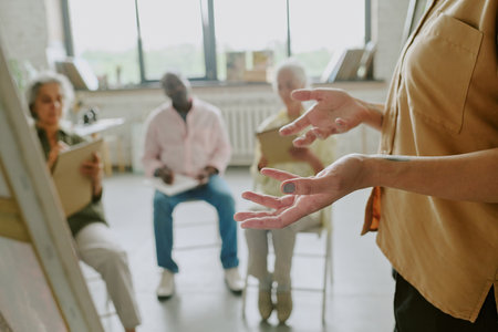 Medium close up of unrecognizable female hands gesticulating in air during explanation