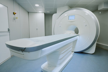 MRI machine standing in modern hospital room with empty patient table extending outward, advanced...