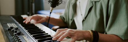 Website banner of teenager playing electronic keyboard, recording music at home studio, hands...