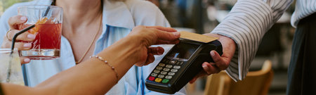 Website banner of Caucasian young adult woman holding drink while paying with credit card using...