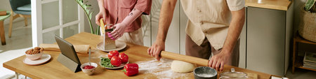 Website banner of man rolling dough while woman with prosthetic arm grating cheese in kitchen, fresh...