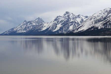Snow Covered Mountain on Lake Sideの写真素材