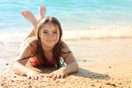 Portrait of kid girl on the beachの写真素材