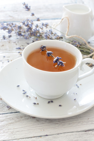 Cup of lavender tea and lavender flowersの写真素材