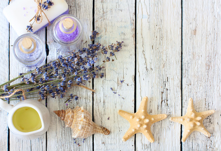 Lavender spa set with soap, lavender flowers, seastars,oil, salt and space for textの写真素材