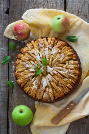 Fresh baked apple pie on the natural wood backgroundの写真素材