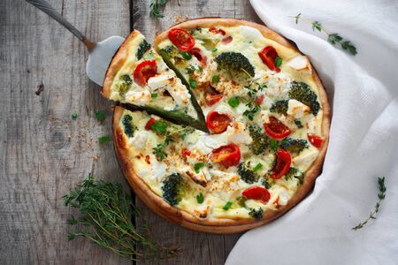 Homemade pie with cream, cheese and vegetablesの写真素材