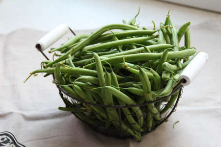 metal basket with fresh, green, green beansの写真素材