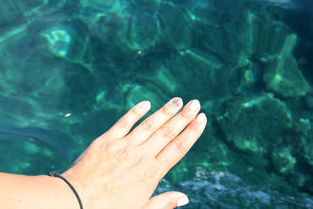 hand, hand over water, hand over turquoise sea water, blue, light and transparent water