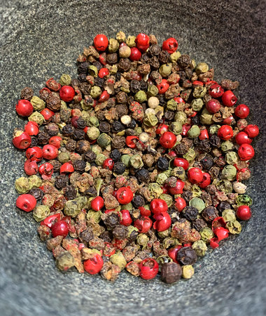 stone mortar, colored pepper, black, red and green pepper, spices