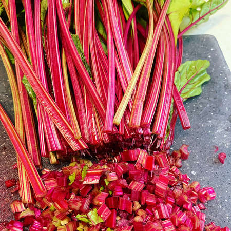 young beetroots, beetroot sprigs, young beetroot, board with sliced beetroot sprigsの写真素材