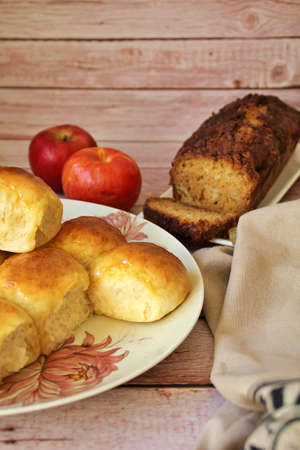 homemade yeast buns, brioche buns, glowing buns, homemade baked goods on a plate, cinnamon cake with...