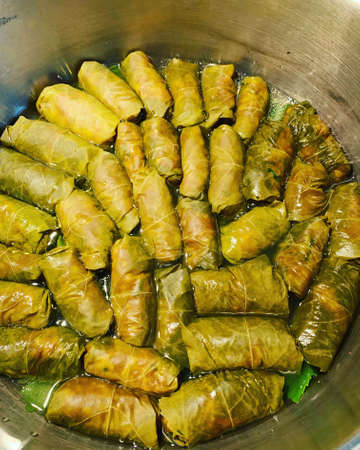 minced meat mixed with rice, stuffing for cabbage rolls, little stuffed cabbage in grape leaves,...