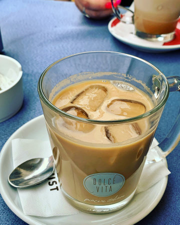 iced coffee, coffee with ice cubes, cold coffee drink, coffee table, coffee in a transparent glass,...