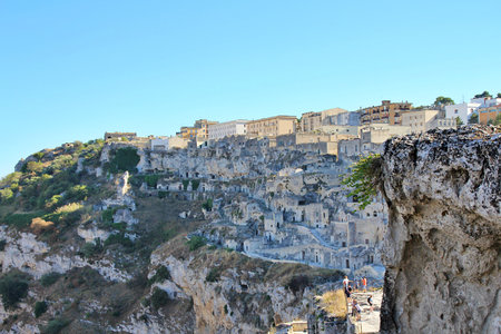 view of the ancient city of Matera, old rock-cut houses, rock city in southern Italy, houses on the...