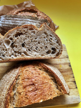 fresh artisan bread, sourdough bread, crusty bread, sliced loaf of bread
