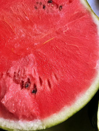 Watermelon close-up as a background. Selective focus, red watermelon, juicy fruit, cut watermelon,...