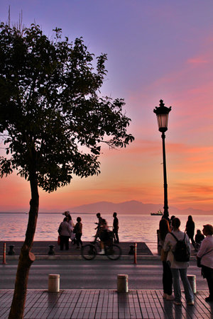 sunset, port city, Thessaloniki, Greece, red sky, seaside street, red-purple sky, along the seaside promenadeの写真素材