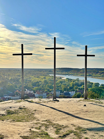 three crosses on a hill in Kazimierz Wielki, view of the small town, Christian crossesの写真素材
