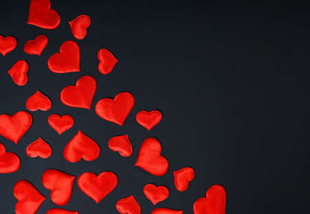 Black background with red hearts Valentines day